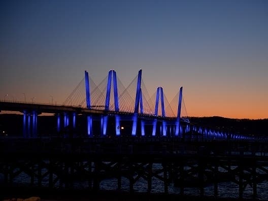 The Governor Mario M. Cuomo Bridge, formerly known as the Tappan Zee Bridge, is lit blue on April 09, 2020, to show support for health care workers and first responds.