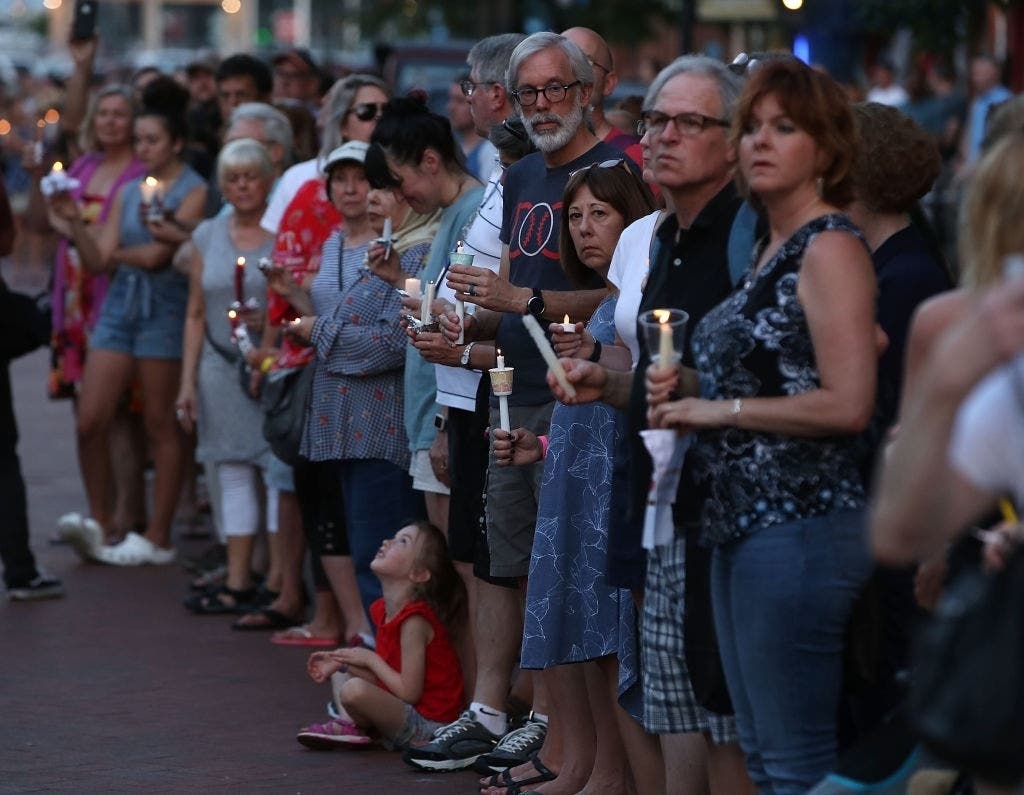 A candlelight vigil honors the 5 people were shot and killed at the Capital Gazette newspaper on June 29, 2018, in Annapolis.