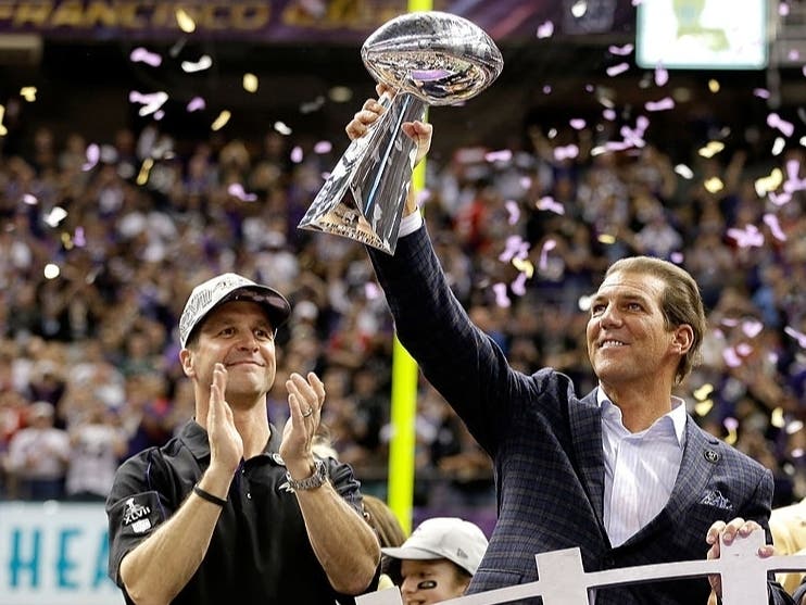 Baltimore Ravens owner Steve Bisciotti, center, and head coach John Harbaugh celebrate with the Vince Lombardi championship trophy when the Ravens won Super Bowl XLVII in 2013. Bisciotti is the second-wealthiest billionaire in Maryland.