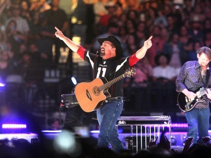 Pictured, Garth Brooks performs at State Farm Stadium in March 2019 in Glendale, Arizona. He will be in Baltimore Oct. 2, 2021.