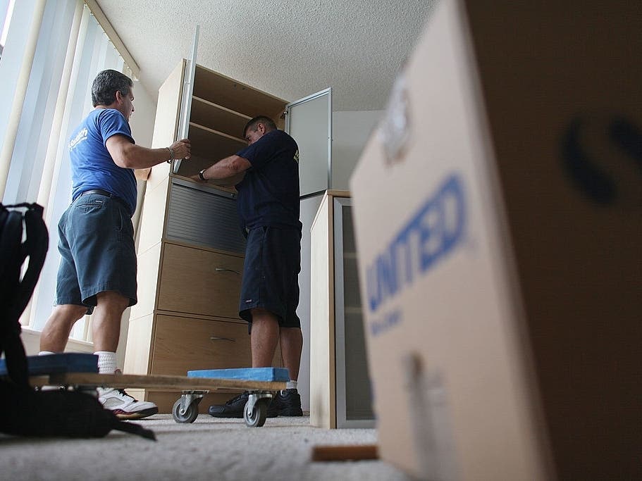 Blue Vasquez and John Ilcheff from United Van Lines prepare household items as they move a customer to San Diego. Maryland is losing more residents than it is gaining, the company said in a new survey.