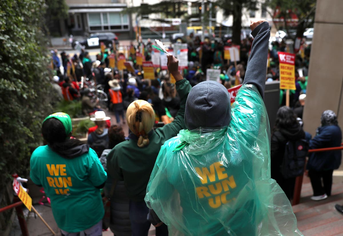 File Photo: UC medical center workers stage a demonstration. Workers plan a one-day strike March 20.