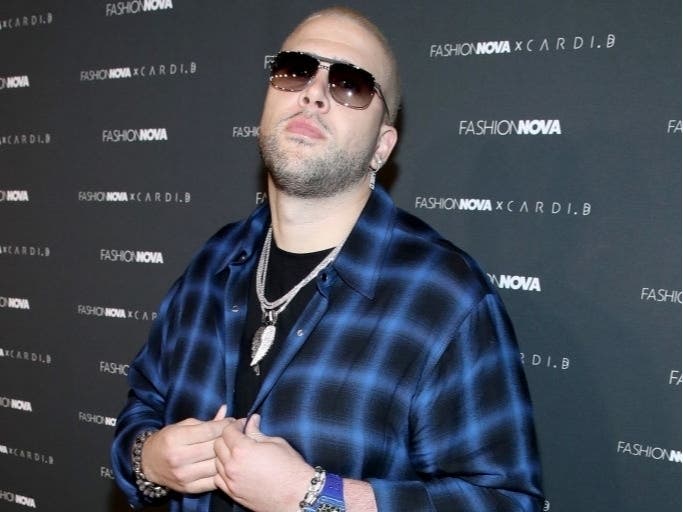 A trio of armed suspects ambushed and robbed two men at gunpoint Thursday morning outside the Encino home of rapper TMG Fresh, and now police are looking for the gunmen.