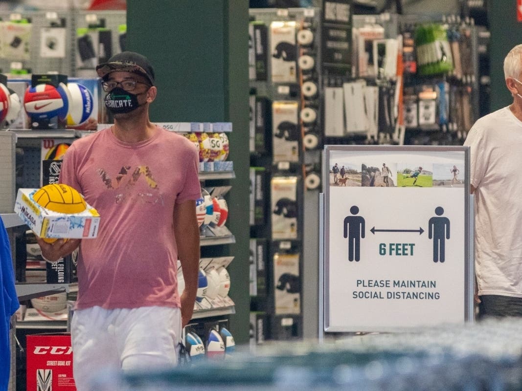 Customers shop in a Dick's Sporting Goods store as Los Angeles County retail businesses reopen while the COVID-19 pandemic continues on May 27, 2020 in Glendale, Californias latest guidelines and allow resumption of in-store shopping at low-risk retail.