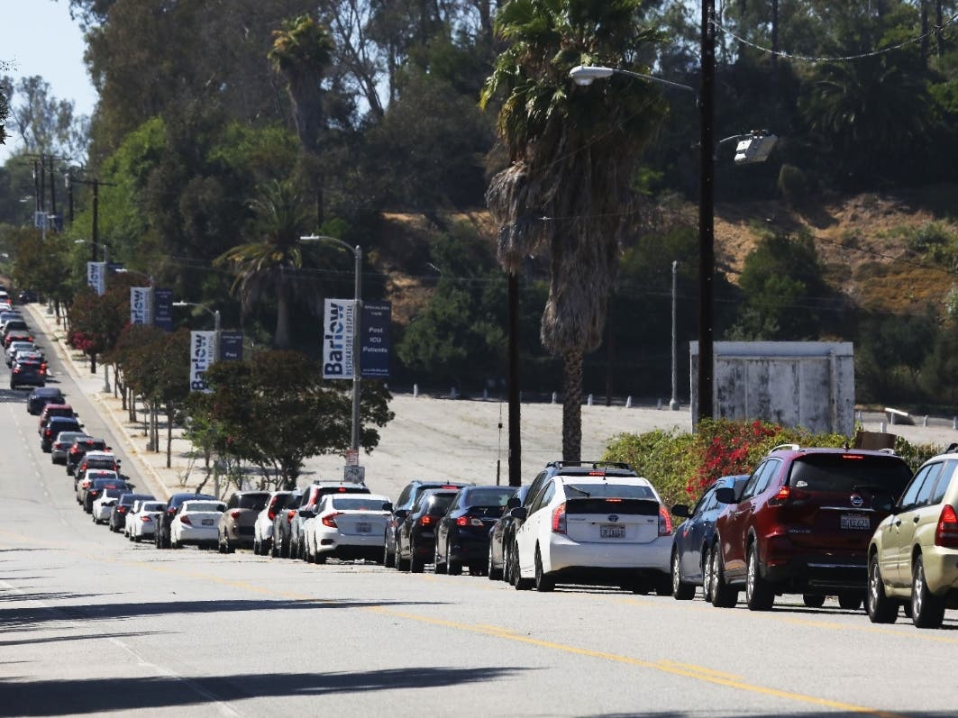  Motorists wait in line to enter the COVID-19 testing center at Dodger Stadium amid the coronavirus pandemic on July 08, 2020 in Los Angeles, California. California posted a record 9,500 new coronavirus cases today, the most in one day in the state since 