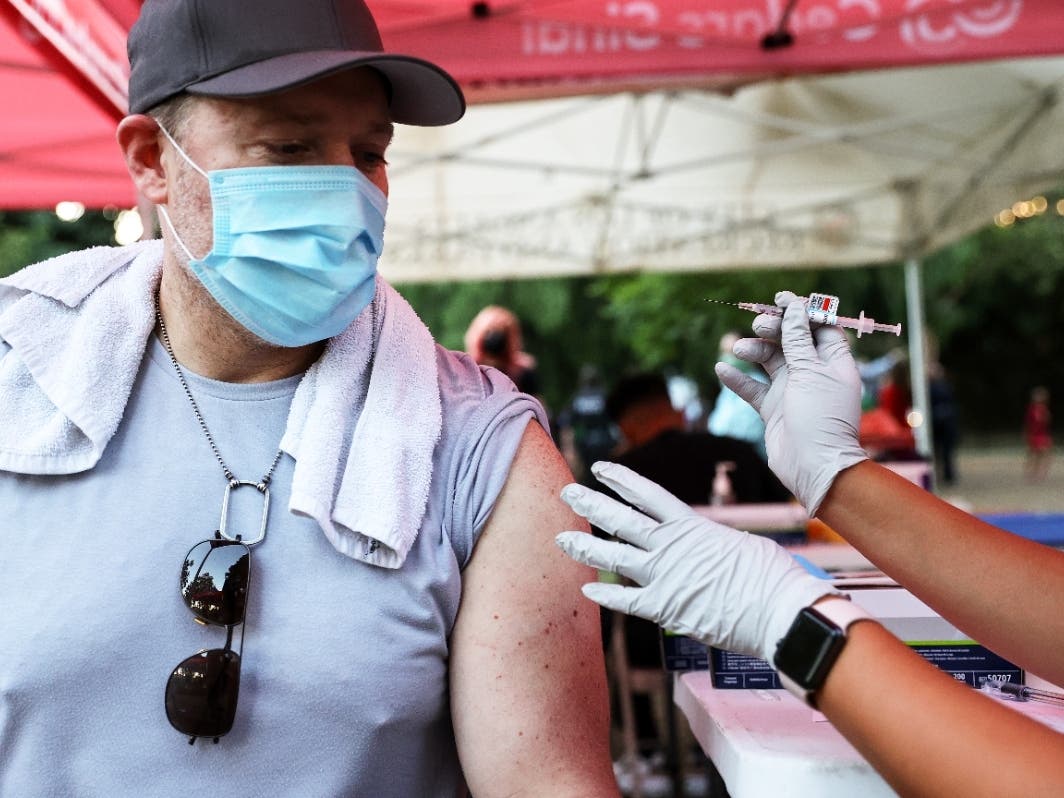 A person waits to receive a COVID-19 vaccination dose as part of a National Night Out event hosted by Melrose Action on Aug. 3 in Los Angeles, California. 