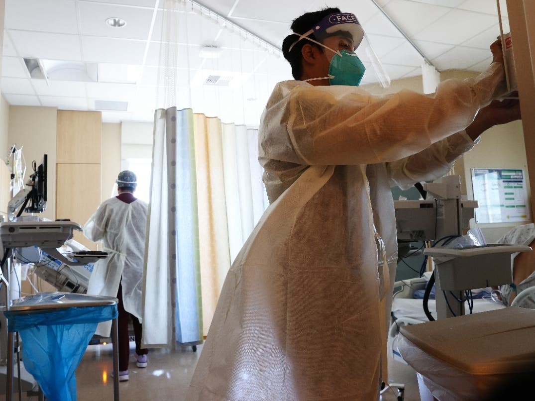 Clinicians work July 30 while caring for COVID-19 patients in the improvised COVID-19 unit at Providence Holy Cross Medical Center in the Mission Hills of Los Angeles, Calif.