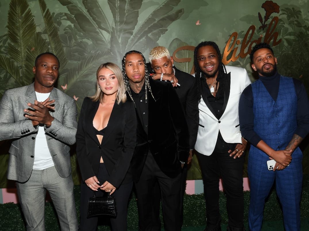 File Photo: (L-R) Dre London, Camaryn Swanson, Tyga, Alexander Edwards, and guests attend h.wood Group's grand opening of Delilah at Wynn Las Vegas on July 10, 2021 in Las Vegas, Nevada. Swanson accused rapper Tyga of abuse.