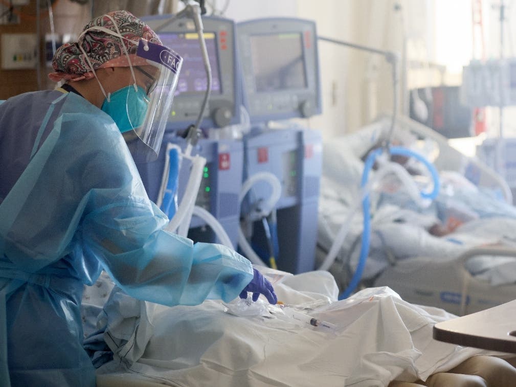 U.S. Air Force 1st Lt. Allyson Black, a registered nurse, cares for COVID-19 patients in a makeshift ICU (Intensive Care Unit) at Harbor-UCLA Medical Center last years as the hospital used military medical personnel to help shore up staff.