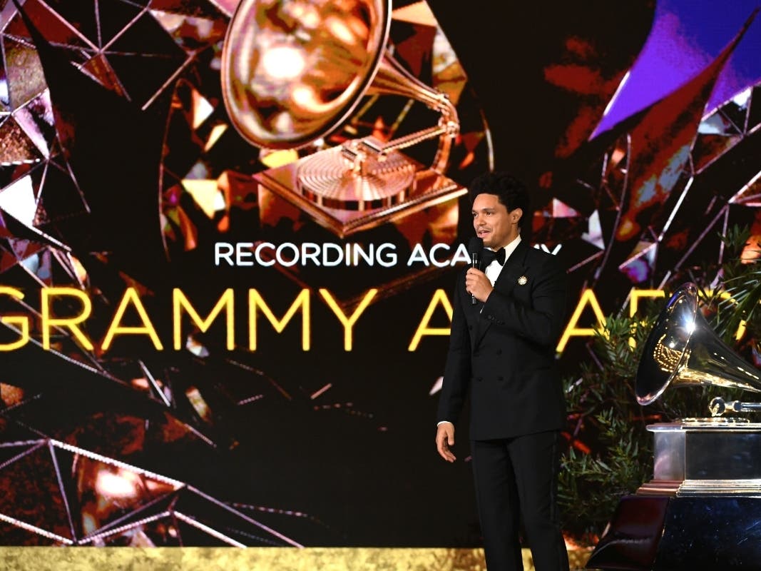 Trevor Noah speaks onstage during the 63rd Annual Grammy Awards in LA. On Wednesday, the 64th annual awards were postponed due to the coronavirus surge. 
