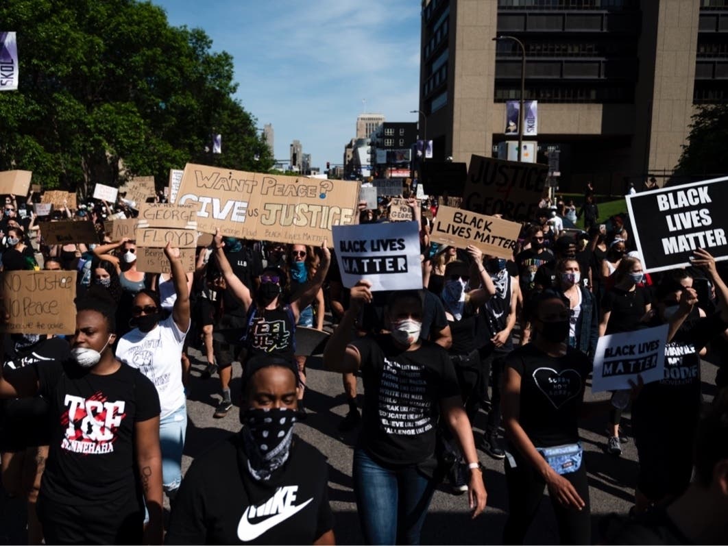 A protest march in honor of George Ford walks through downtown May 31, 2020, in Minneapolis.