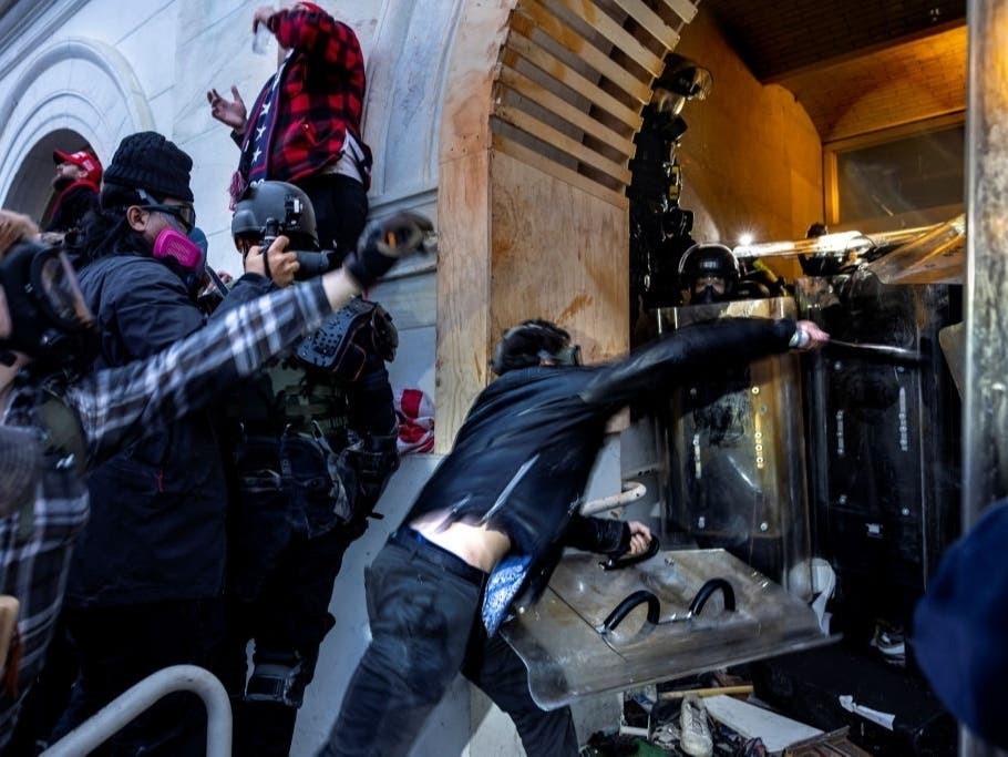 Trump supporters clash with police and security forces as people try to storm the US Capitol on January 6, 2021 in Washington, DC. 