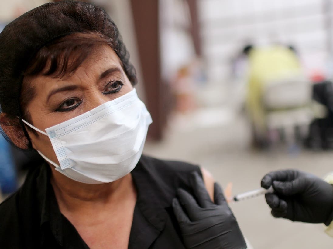 A woman in Riverside County receives the one-dose Johnson & Johnson vaccine.  