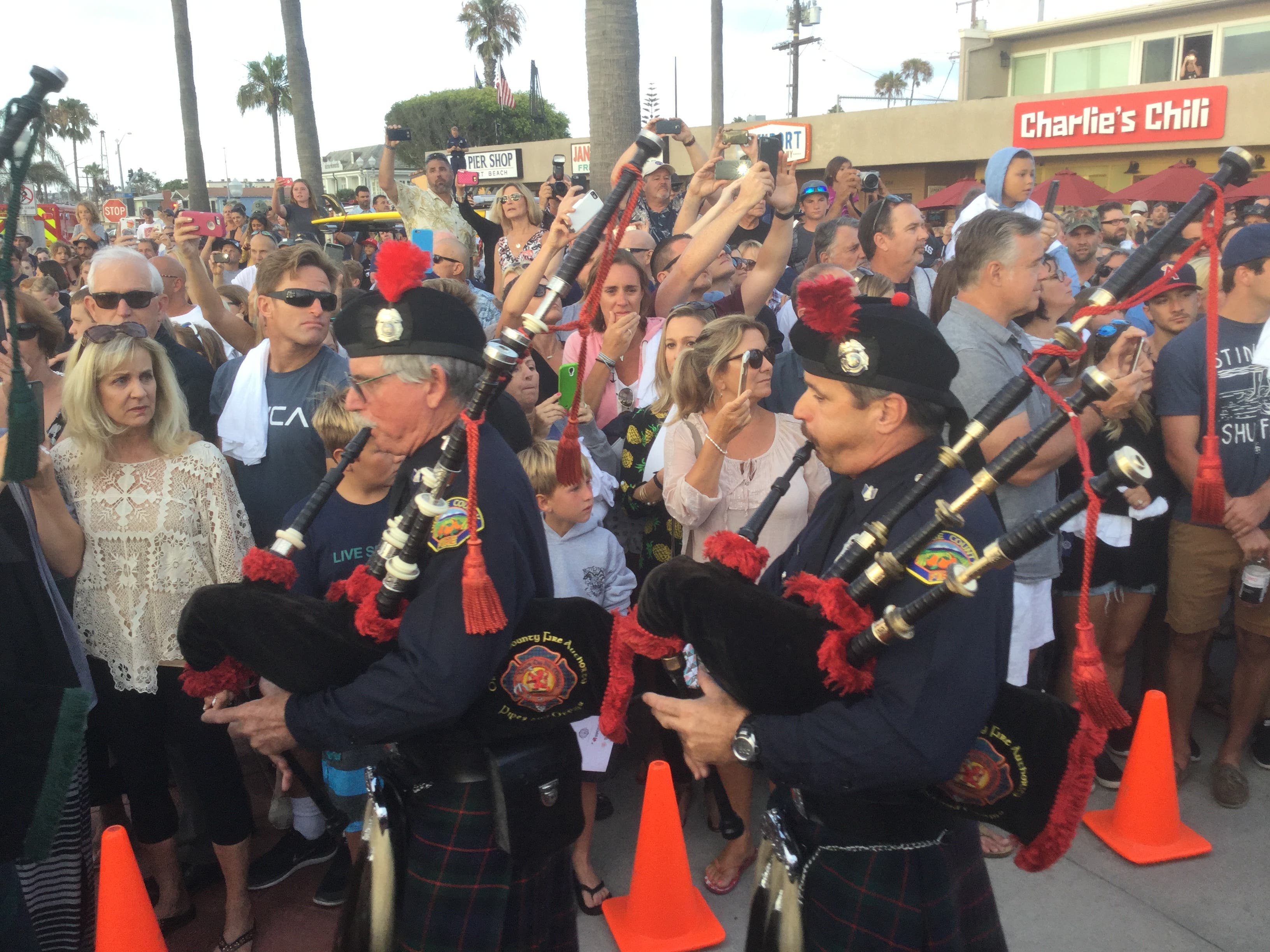 Bagpipers sounded their tunes as the crowd watched the procession. (Steve Concialdi Photo)