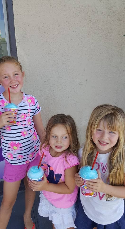 Realtor mom Stevie Ceccerelli paused her workday to take these three for three Free Slurpees (Courtesy)