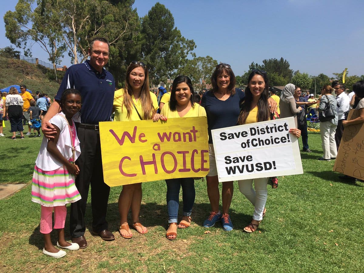 Superintendent Dr. Robert Taylor, with Quail Summit Elementary teachers Cindy Giang, Jessica Cabral, Christy McCabe (retired), Alex Rovira, and Chaparral Middle School student Malak Abdelmuati attend rally to make sure parents keep their right to send students to the school of their choice