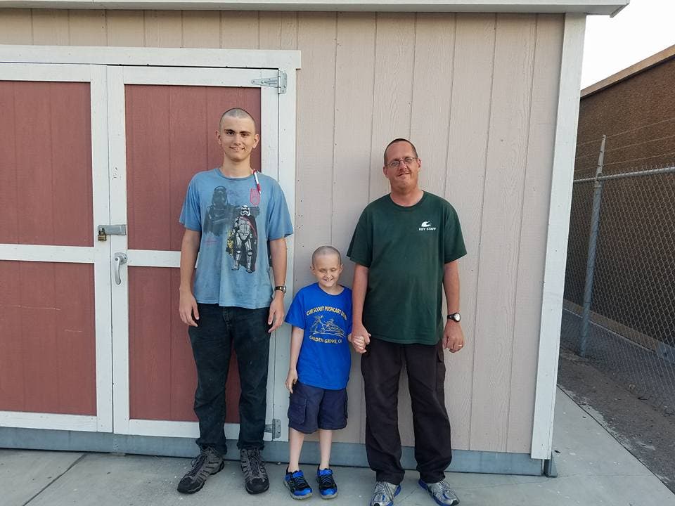 David, Joey, and David-John Born all shaving their heads in support of Olly and his battle against cancer (Traci Born, Photo).