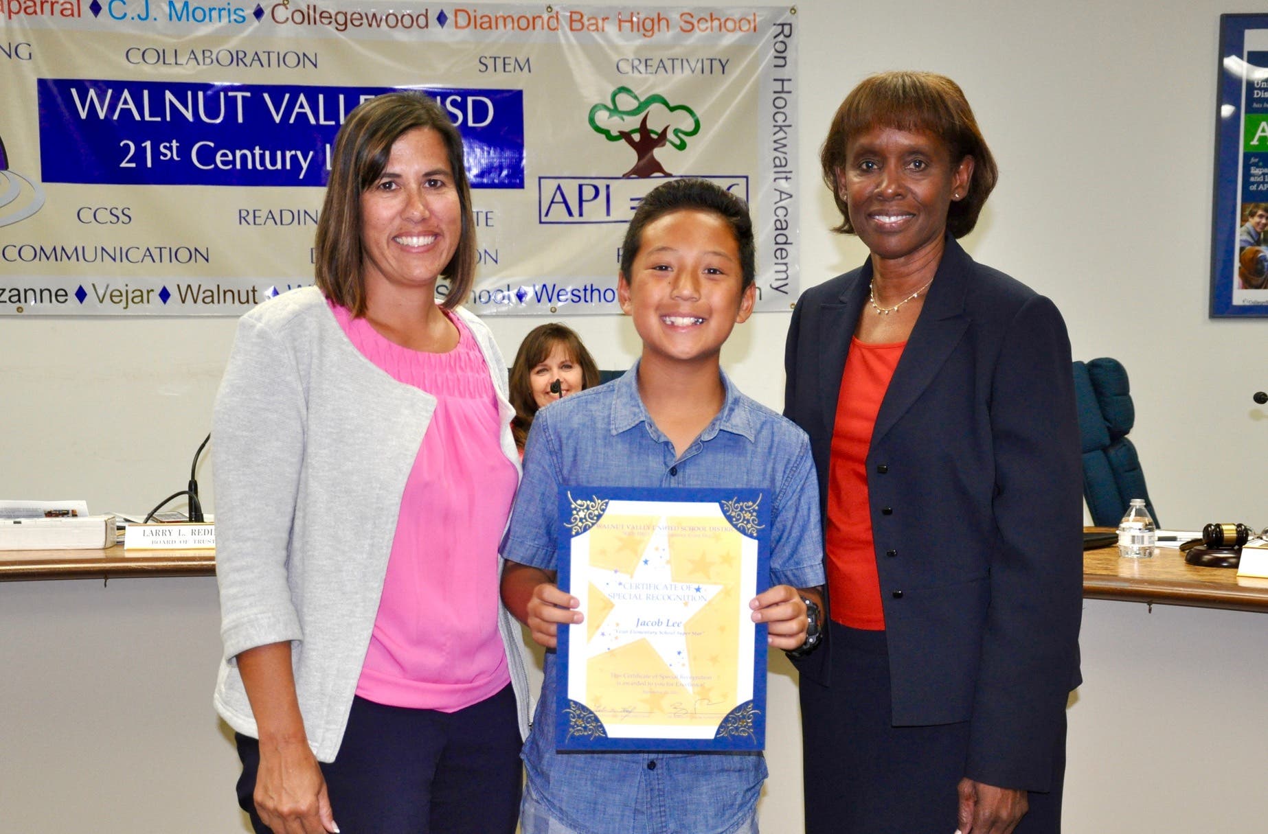 Vejar Elementary 5th grader Jacob Lee is honored with the Super Star Student Award on September 21. Shown with Principal Jennifer De Anda and Board President Helen Hall. 