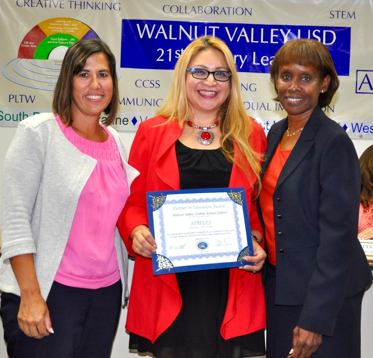 Staples in Walnut receives the Partner in Education award for their support at Vejar Elementary. Shown with Principal Jennifer De Anda and Board President Helen Hall.
