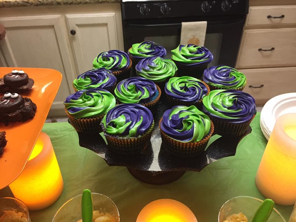 Halloween Cupcakes on a Glittery candle lit table Halloween Cupcakes on a Glittery candle lit table