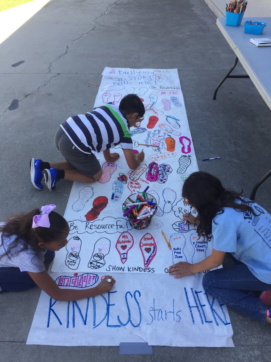 Collegewood Elementary students stomp out bullying with kindness. (CWD kindness banner)