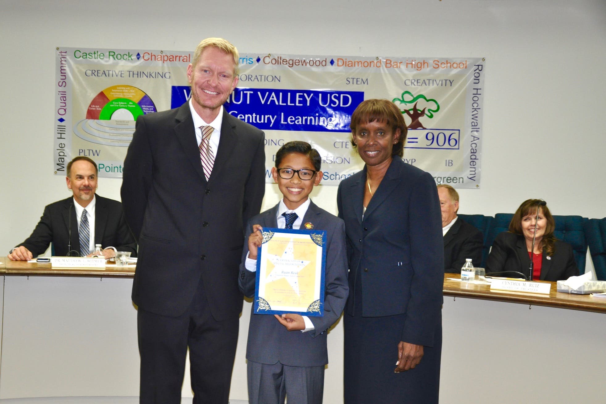 Chaparral Middle School 8th grader Ryan Real receives the Super Star Student Award. Shown with Principal Ron Thibodeaux and Board President Helen Hall.