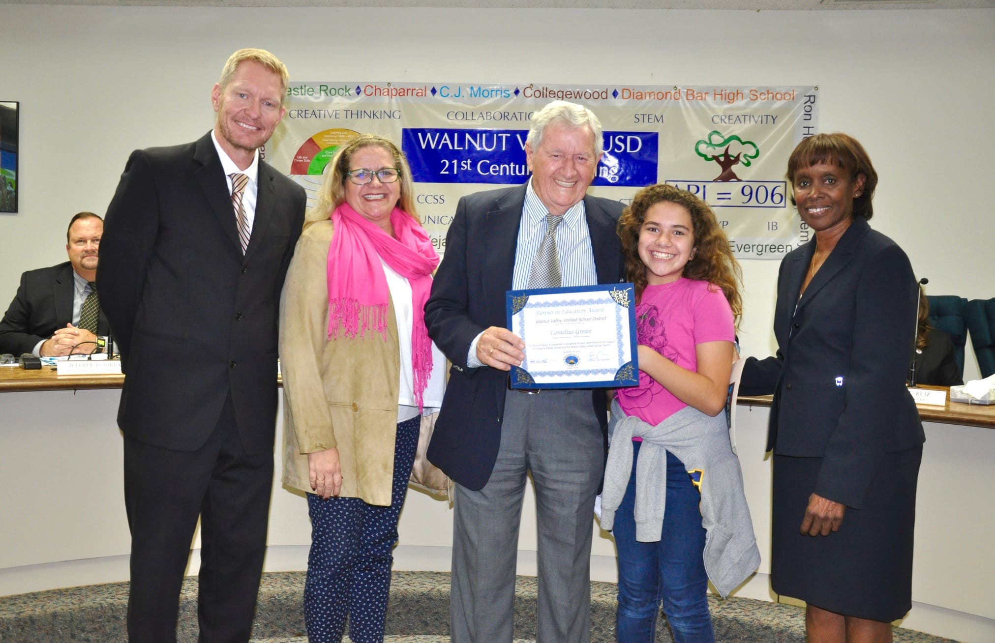 Artist Cornelis Greive is honored with the Partner in Education Award for service at Chaparral Middle School. Shown with Principal Ron Thibodeaux, daughter Sarah Ramirez, granddaughter Grace Ramirez, and Board President Helen Hall. 