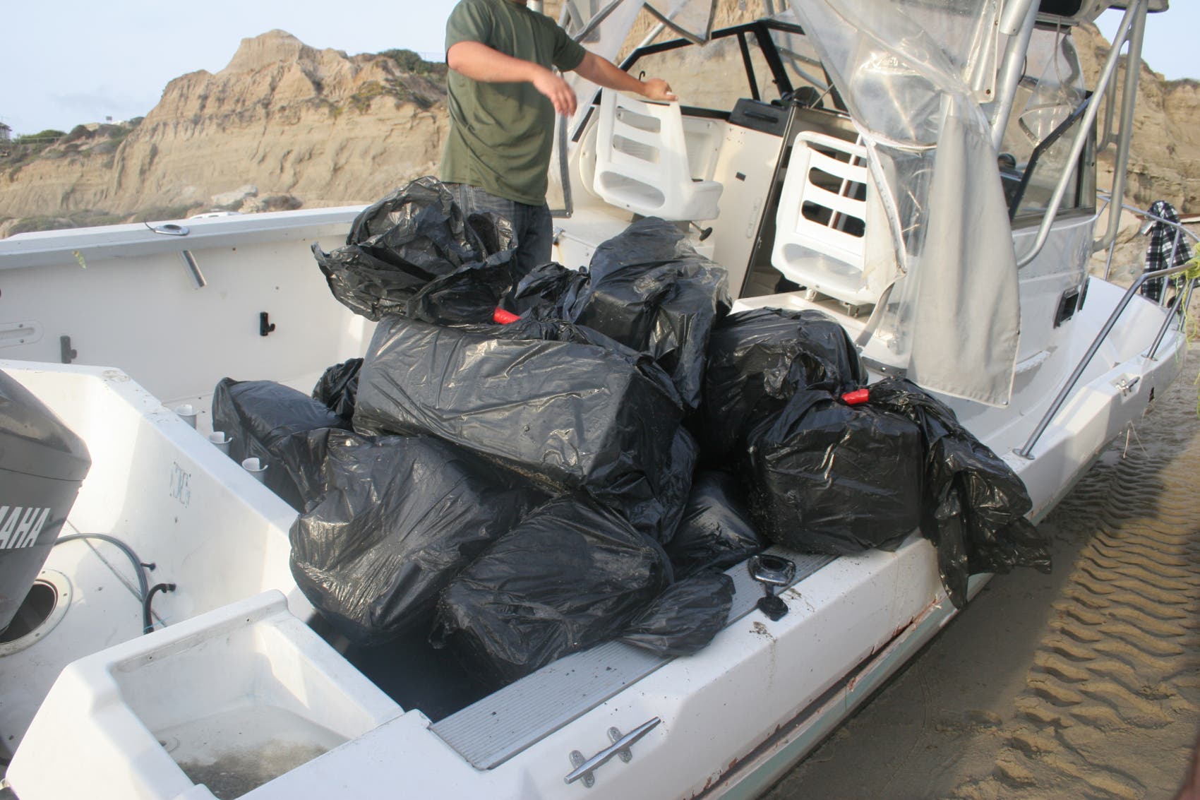 In total, 82 bundles of marijuana were seized, which weighed 2411.86 pounds and had an estimated street value of $1,205.930. In total, 82 bundles of marijuana were seized, which weighed 2411.86 pounds and had an estimated street value of $1,205.930.