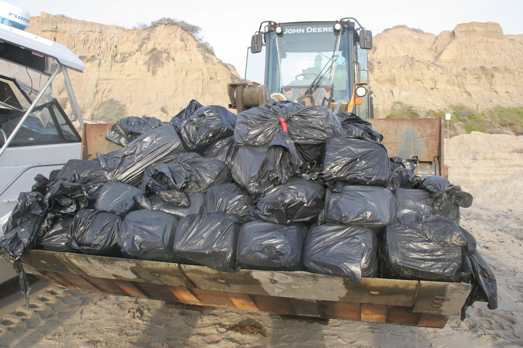 Agents from the U.S. Border Patrol seized the abandoned boat and narcotics. Agents from the U.S. Border Patrol seized the abandoned boat and narcotics.