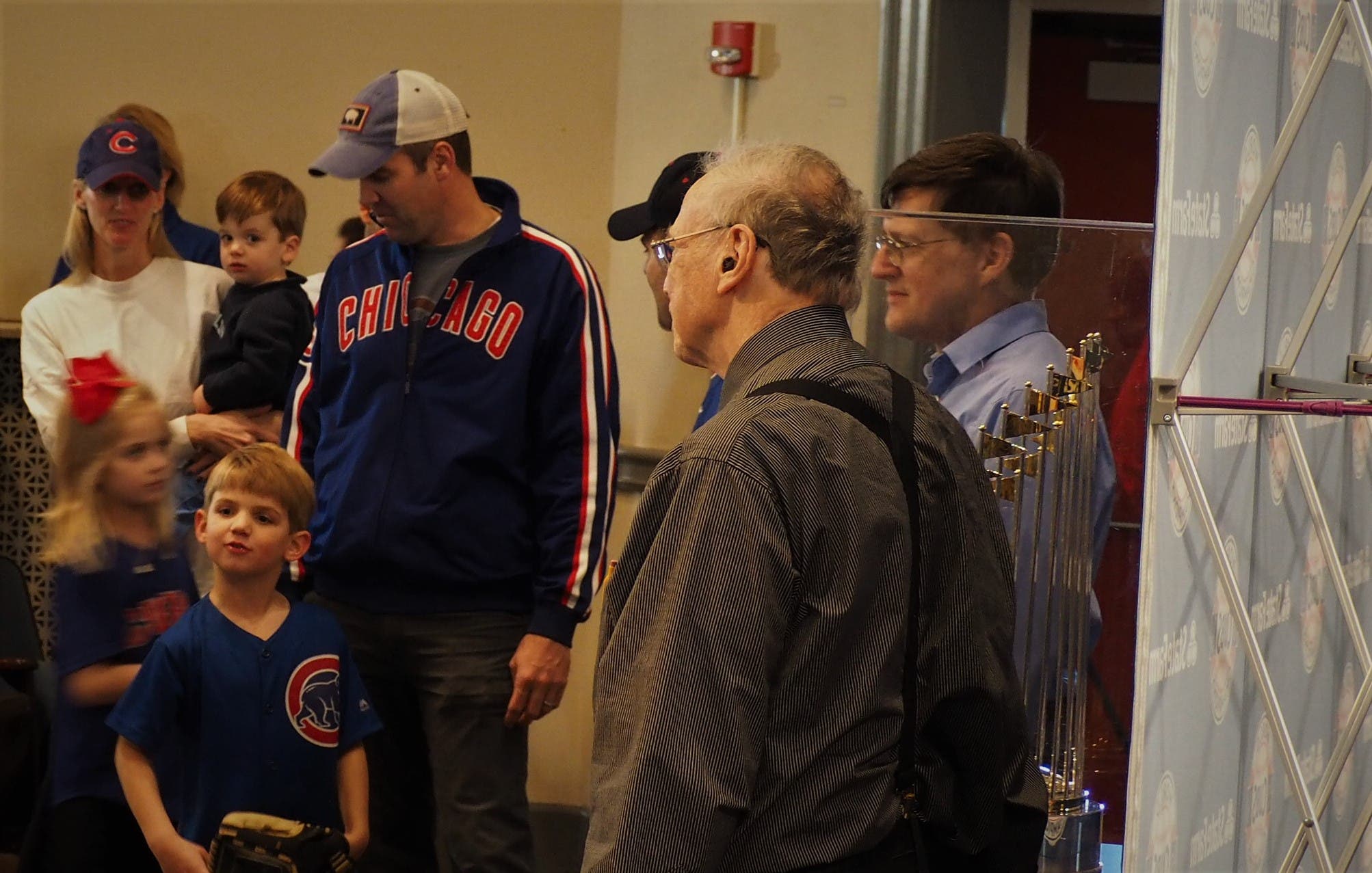 David and Robert Miller take their picture with the Commissioner's Trophy
