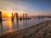 The sun sets over Sandy Hook Bay.