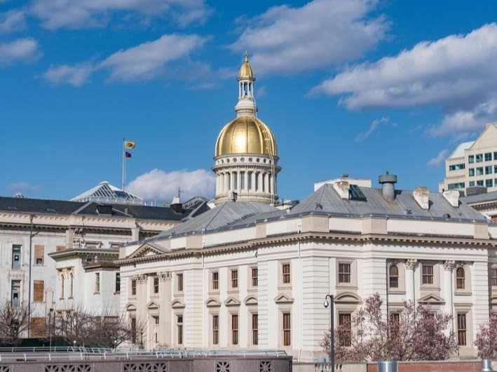 Gov. Phil Murphy signs legislation that forbids police officers to be within 100 feet of poll locations at New Jersey's State House in Trenton.