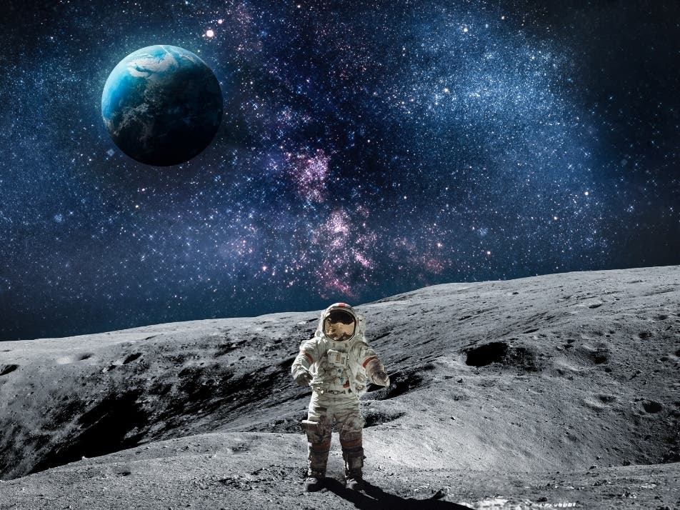 Moon surface with astronaut on it.