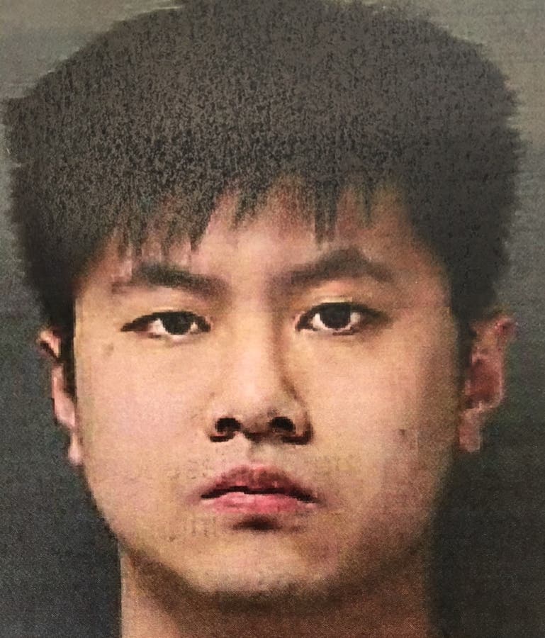 The booking mug shot of Xiangyu He.