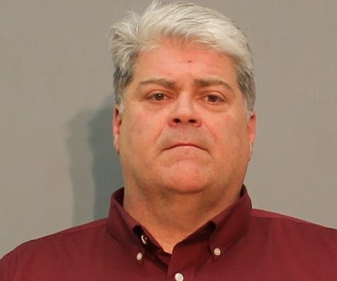 The booking mug shot of Paul Olson.