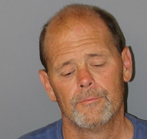 The booking mug shot of Christopher Warren Sinon.