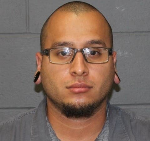 The booking mug shot of Juan Rivera.