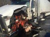 An SUV hit a truck in Tolland Monday. 