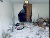 A car slammed into a Tolland home Friday. 