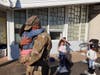 Sgt. 1st Class David Flint hugs his daughter, Gabriella, at Vernon's Lake Street School on Monday after returning home from a Middle East deployment. 