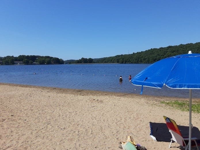 The beach at Newhoca Park in Vernon with Bolton Lake in the background. 