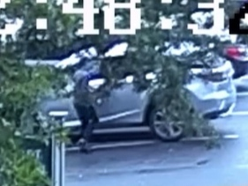 A surveillance camera image of a car theft in Manchester Monday. 