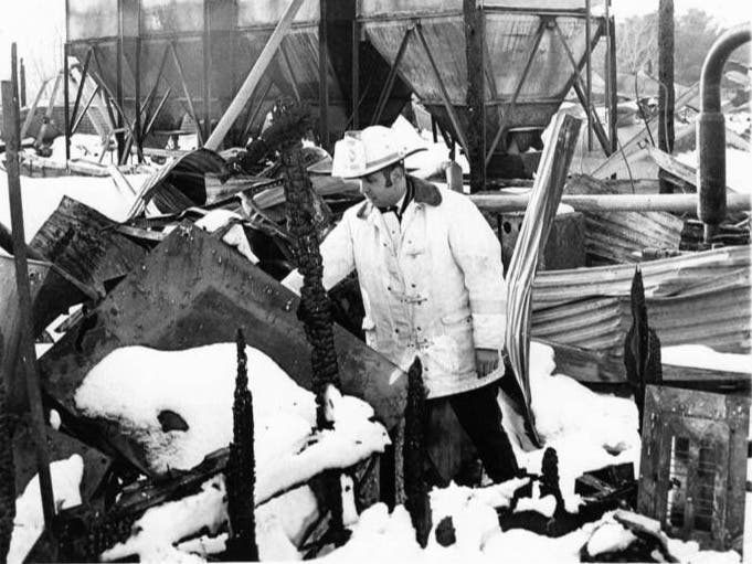 Retired Tolland Fire Chief Ronald Littell Sr. checks the damage after the 1972 chicken coop fire. 
