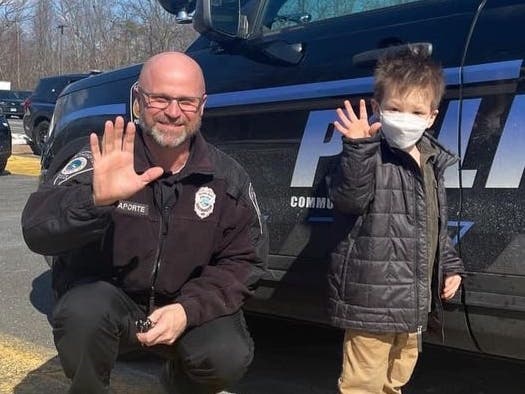  Officer Chris Laporte with a young resident after a recent tour of the SPD. 