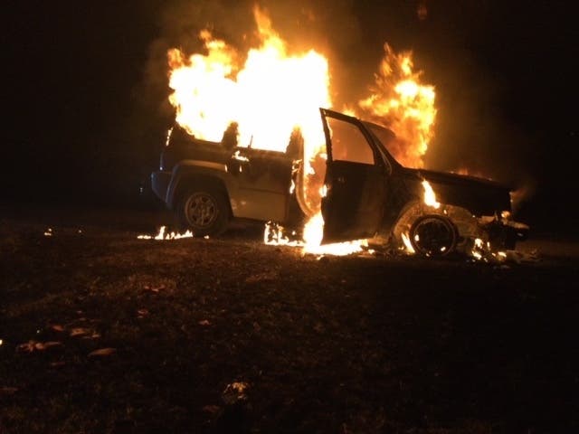 A vehicle burst into flames Thursday on Interstate 84 in Tolland. 