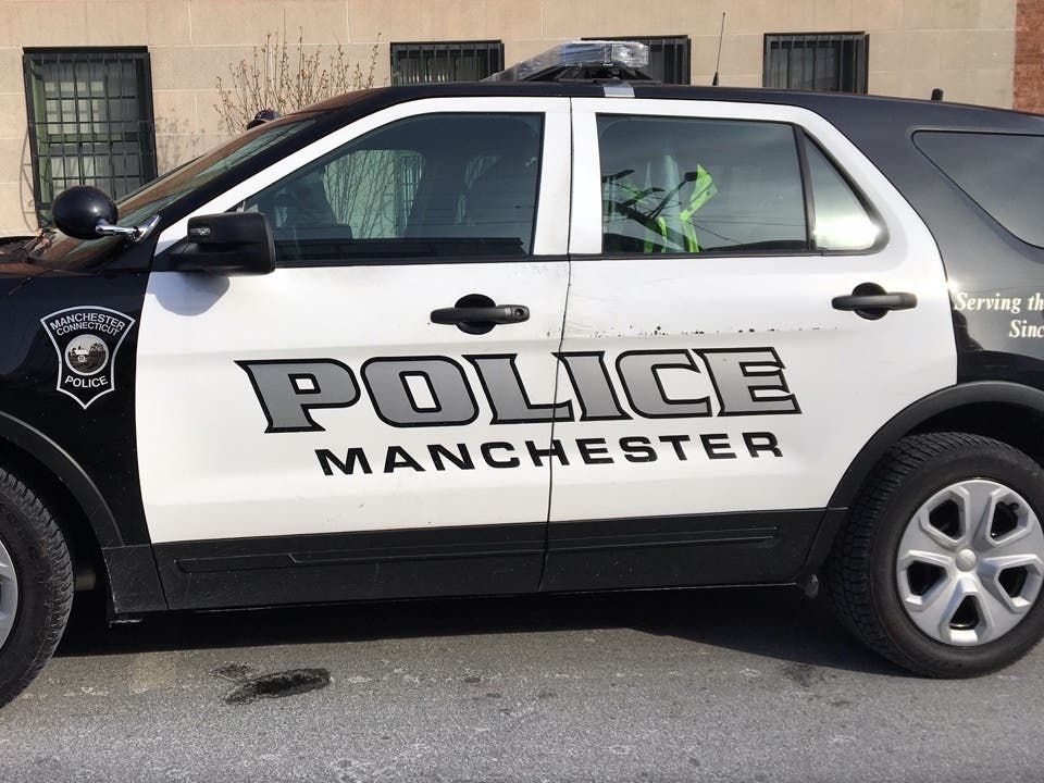 Two people were found with stab wounds in a Manchester hotel room. 