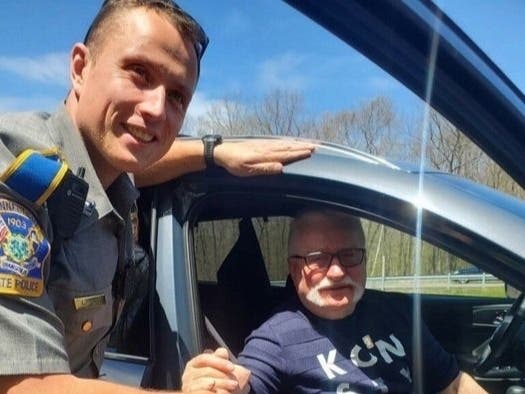 Trooper Lukasz Lipert, a native of Poland, met former Polish President Lech Walesa while assisting with a flat tire on Interstate 84 in Tolland Wednesday.