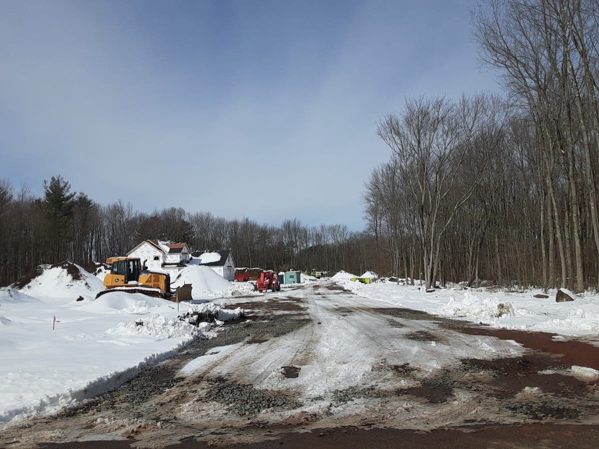 A new housing development off Bolton Branch Road, shown this week, was the site of a summertime fatal trench collapse in Vernon. Criminal charges were filed Friday in the case. 