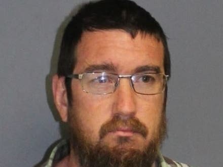 The state police booking Image of Kris Coffey. 