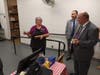 Superintendent of Schools Joseph Macary and assistant superintendent Robert Testa Thursday made a special visit to the Center Road School cafeteria and presented a commemorative pen to manager Annette Grant for her quarter-century of service.  